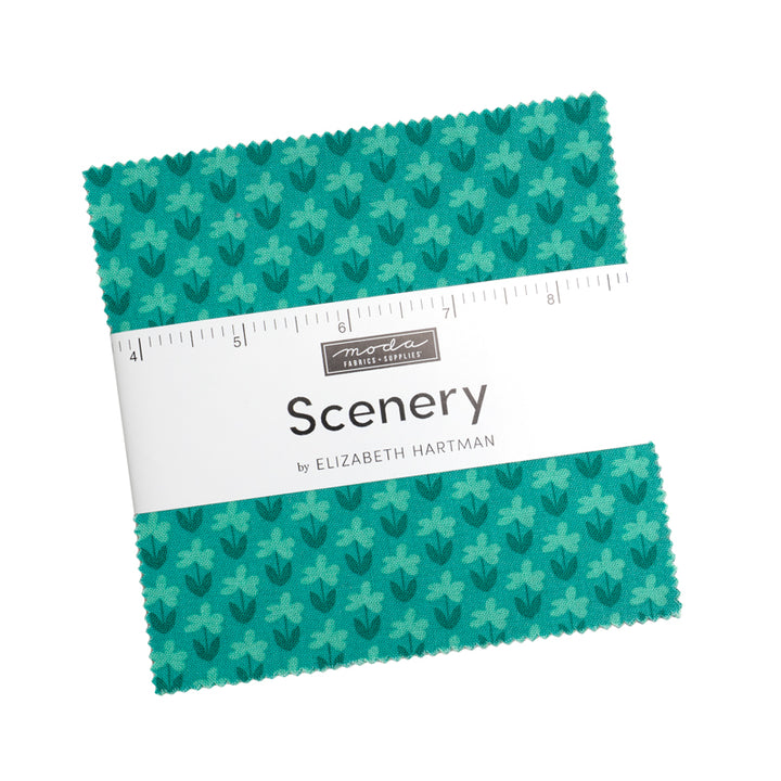 Elizabeth Hartman's Scenery Fabric Collection featuring teal fabric squares with a subtle leaf pattern, ideal for quilting, sewing, and modern needlework projects.