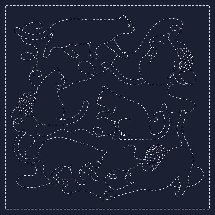 All You Need is Cats Sashiko Sampler featuring playful cats and yarn balls stitched with traditional white sashiko thread on navy fabric, ideal for Japanese craft supplies and embroidery kits.