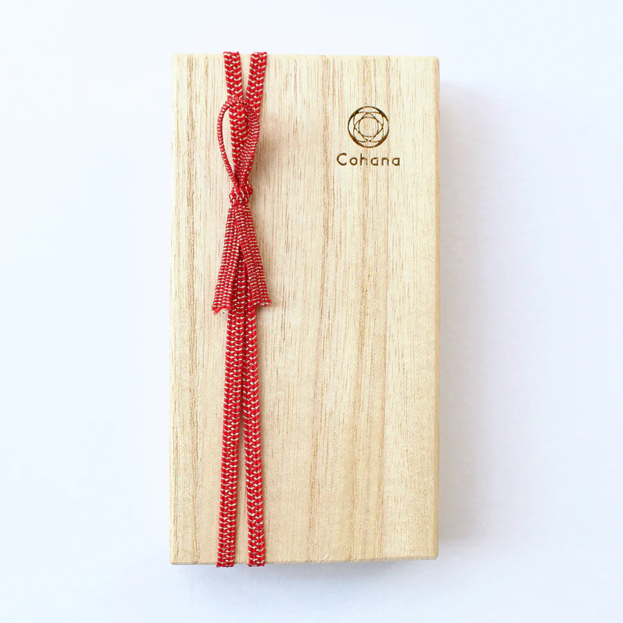 Wooden gift box with a red woven cord, subtle branding, designed to hold Japanese Artisan Lacquered Handle Embroidery Scissors, perfect for craft enthusiasts and embroidery thread users.