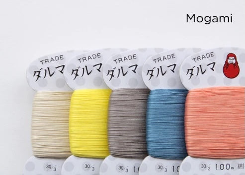 Close-up of five carded embroidery threads in cream, yellow, gray, blue, and coral shades from the Daruma Home Thread #30 Carded Collections, ideal for Japanese craft supplies and modern needlework.