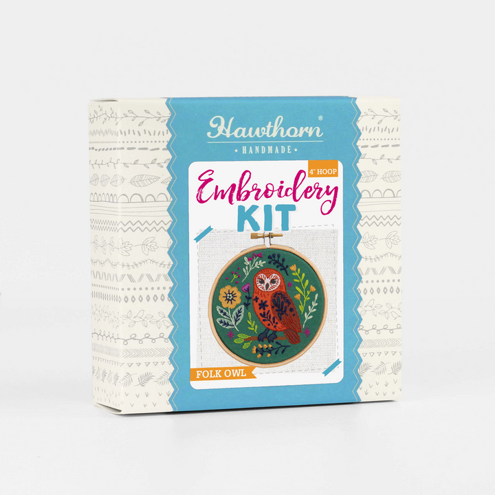 Embroidery kit packaging with owl design on a white background