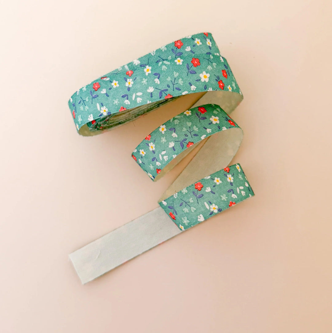 Floral-patterned ribbon on a beige background