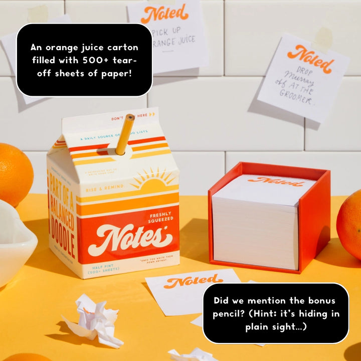 Brass Monkey Freshly Squeezed Note Pad designed like an orange juice carton with over 500 tear-off sheets, displayed alongside a bonus pencil and notes on a bright yellow surface.