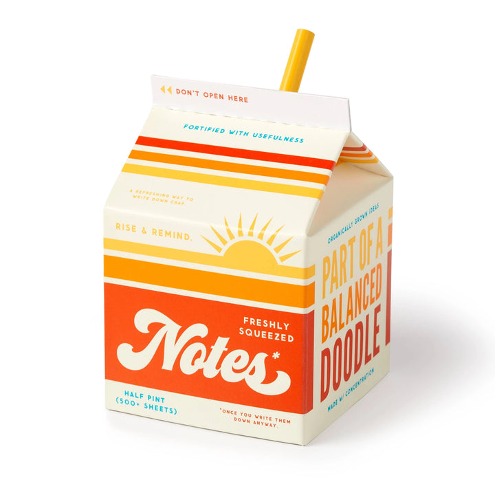 Brass Monkey Freshly Squeezed Note Pad designed like a retro milk carton with bright orange and yellow stripes, perfect for jotting down reminders and doodles.