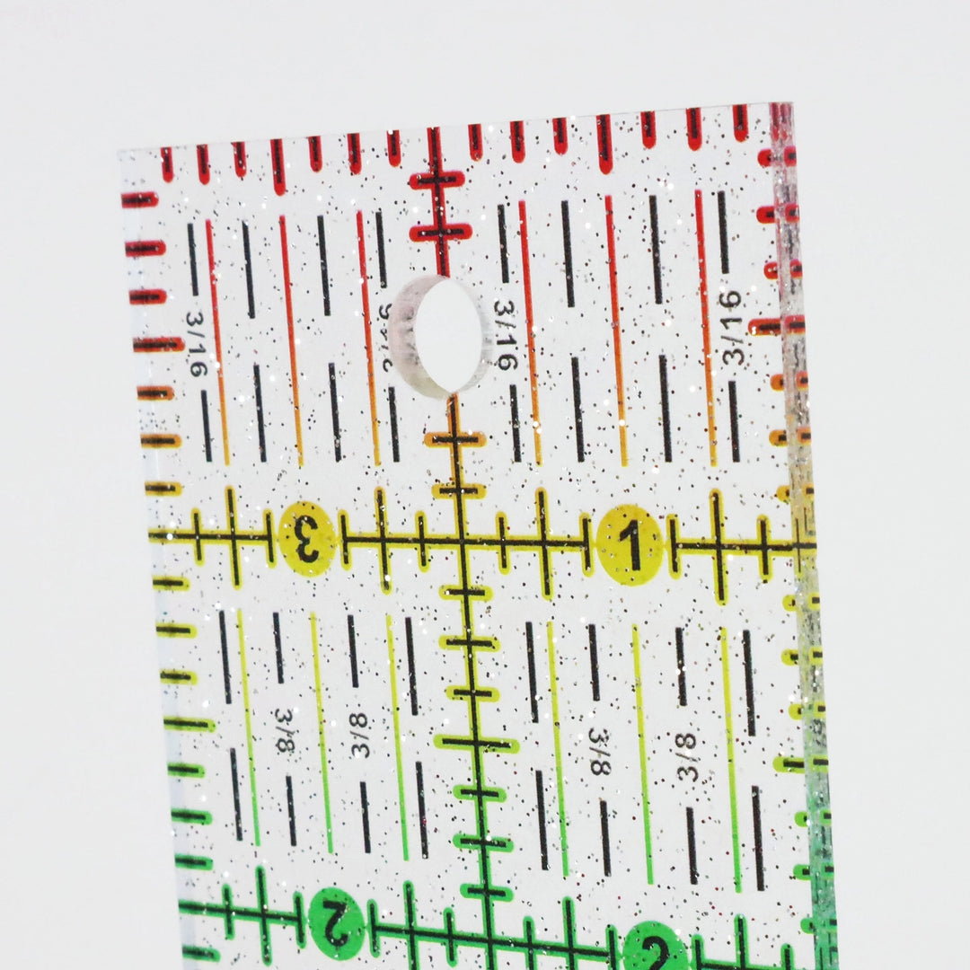Rainbow Gradient Glitter Ruler (2" x 4") featuring precise measurement markings in red, yellow, and green with sparkling glitter, ideal for modern needlework and embroidery projects.
