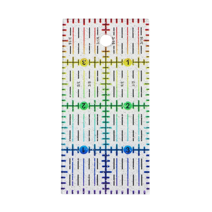 Rainbow Gradient Glitter Ruler (2" x 4") featuring clear plastic with colorful gradient markings and sparkly glitter, ideal for precise measurements in embroidery and modern needlework projects.