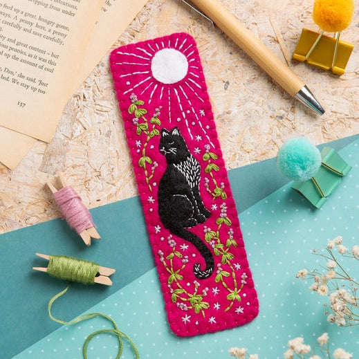 Black Cat wool bookmark on a desktop backdrop