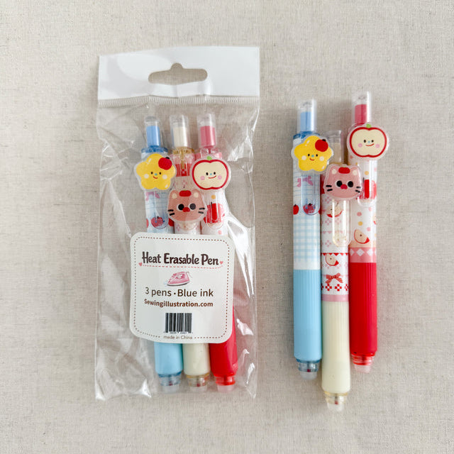Set of five heat erasable pens with cartoon characters on a beige background