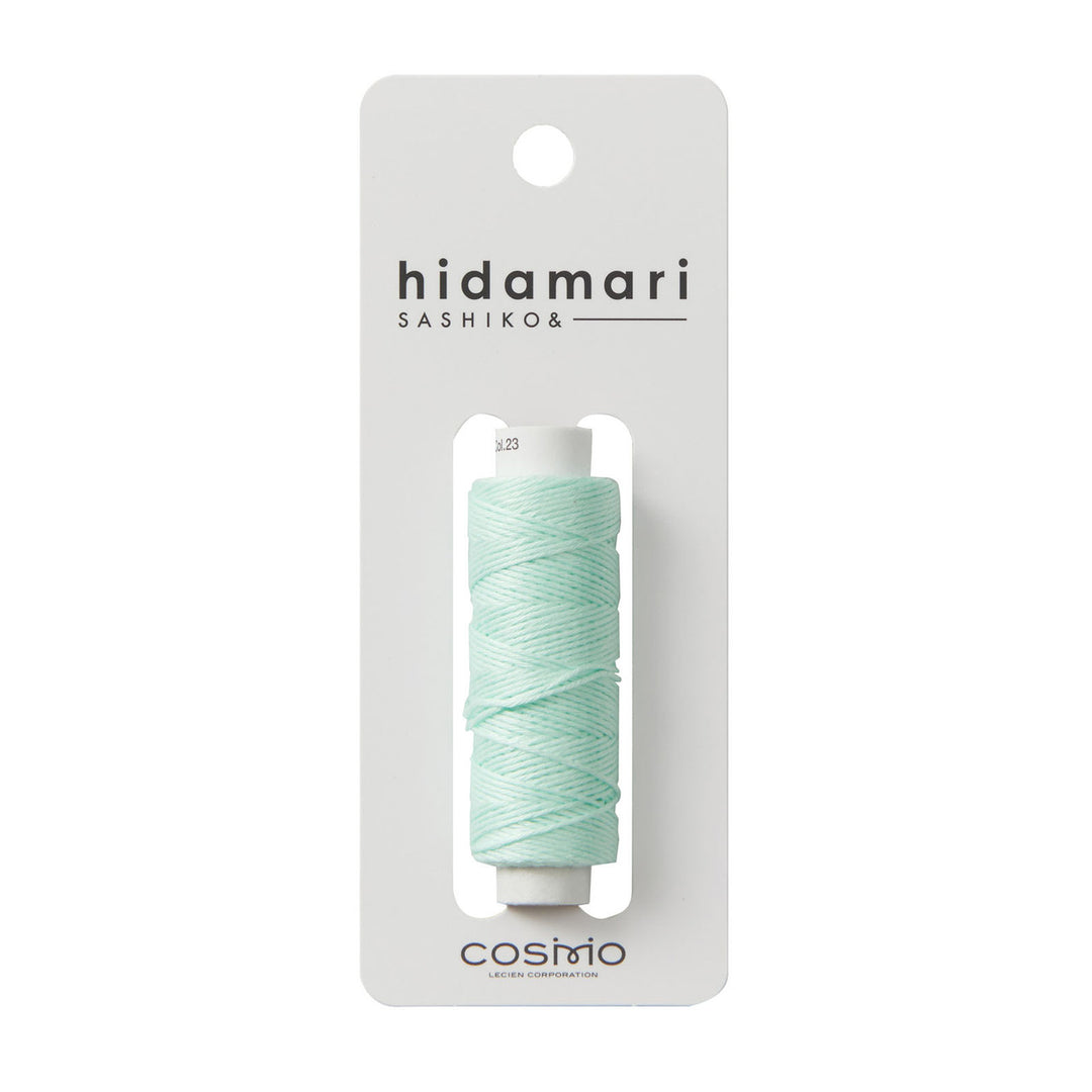 Cosmo Hidamari Sashiko Thread - Mint (#23) spool of soft mint green embroidery thread on white card, ideal for Japanese craft supplies and sashiko needlework projects.