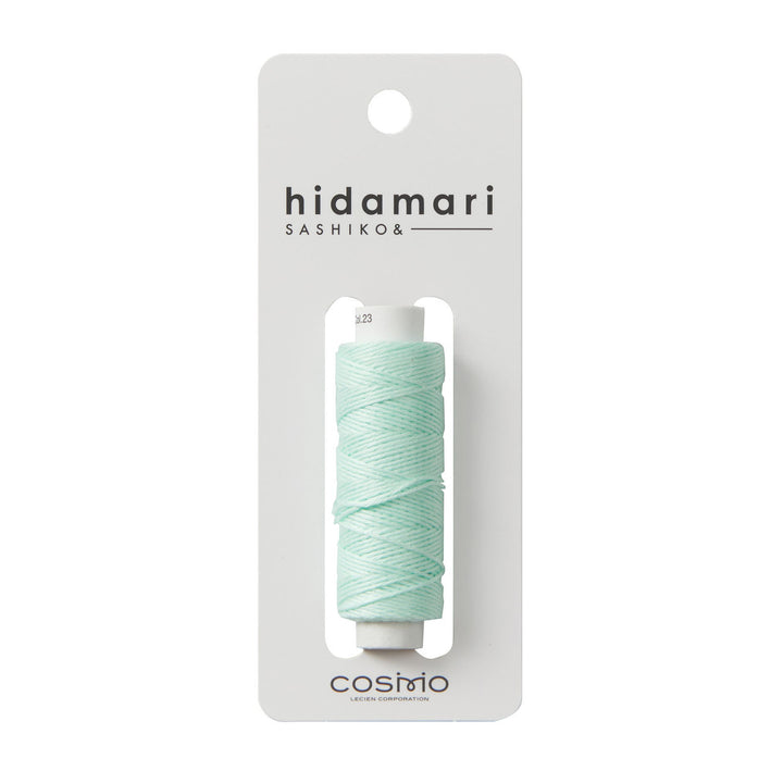 Cosmo Hidamari Sashiko Thread - Mint (#23) spool of soft mint green embroidery thread on white card, ideal for Japanese craft supplies and sashiko needlework projects.