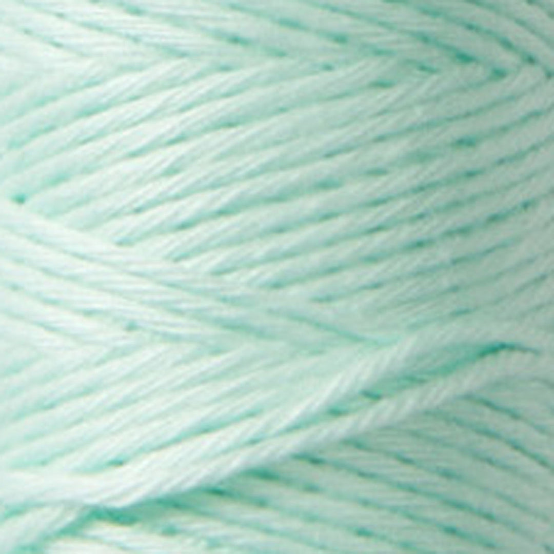 Close-up of soft mint-colored thread strands from Cosmo Hidamari Sashiko Thread - Mint (#23), ideal for Japanese craft supplies and sashiko embroidery projects.