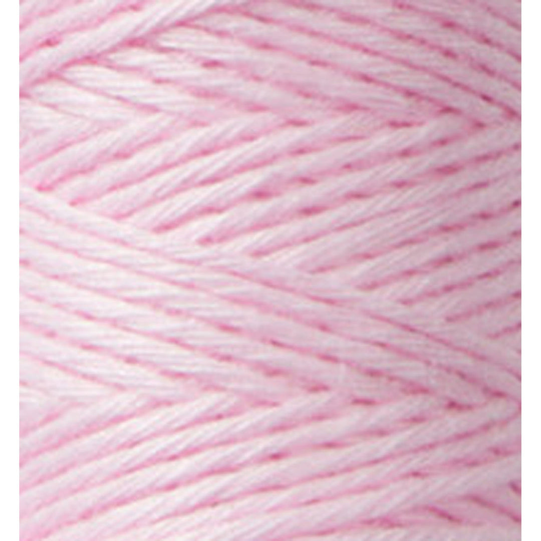Close-up of soft pink embroidery thread showing detailed texture and twist of Cosmo Hidamari Sashiko Thread - Marshmallow (#24) for Japanese craft supplies and modern needlework.