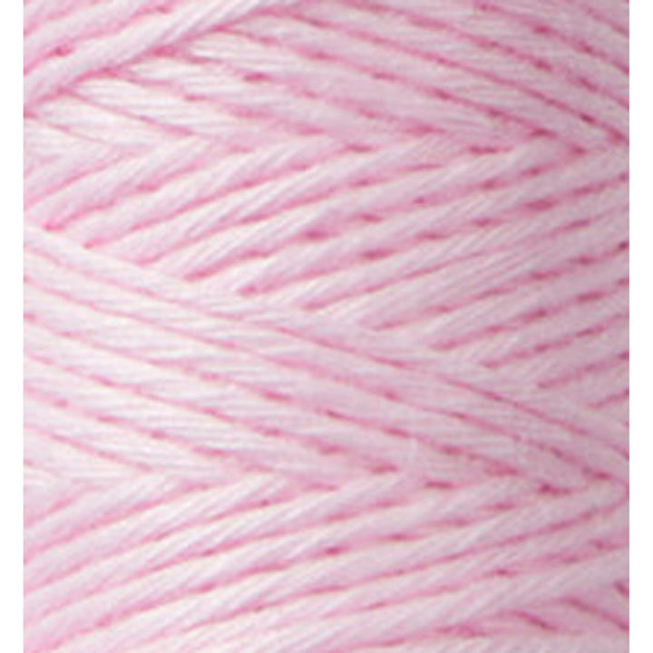 Close-up of soft pink embroidery thread showing detailed texture and twist of Cosmo Hidamari Sashiko Thread - Marshmallow (#24) for Japanese craft supplies and modern needlework.