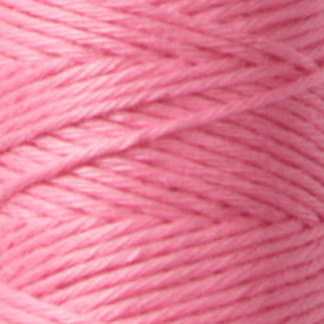 Close-up of soft pink embroidery thread strands neatly wound, showcasing texture and quality of Cosmo Hidamari Sashiko Thread - Cosmos Field (#26) for Japanese craft supplies and sashiko.