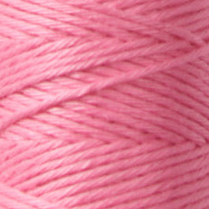Close-up of soft pink embroidery thread strands neatly wound, showcasing texture and quality of Cosmo Hidamari Sashiko Thread - Cosmos Field (#26) for Japanese craft supplies and sashiko.