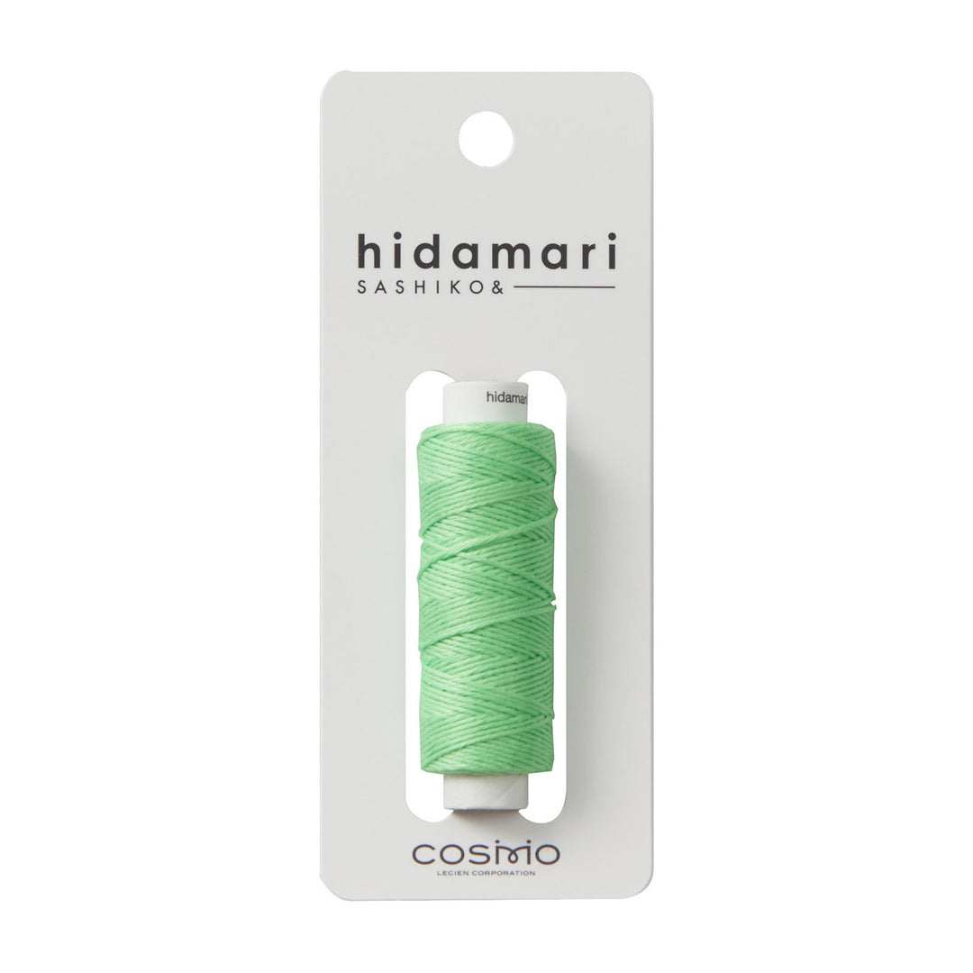 Cosmo Hidamari Sashiko Thread - Pistachio (#27) spool in light green, high-quality Japanese craft supply ideal for sashiko embroidery and modern needlework projects.
