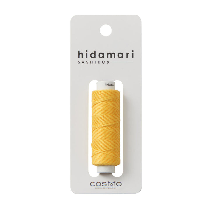 Cosmo Hidamari Sashiko Thread - Goldenrod (#28) in bright yellow shade, displayed on a white card, ideal for sashiko and modern needlework using Japanese craft supplies.