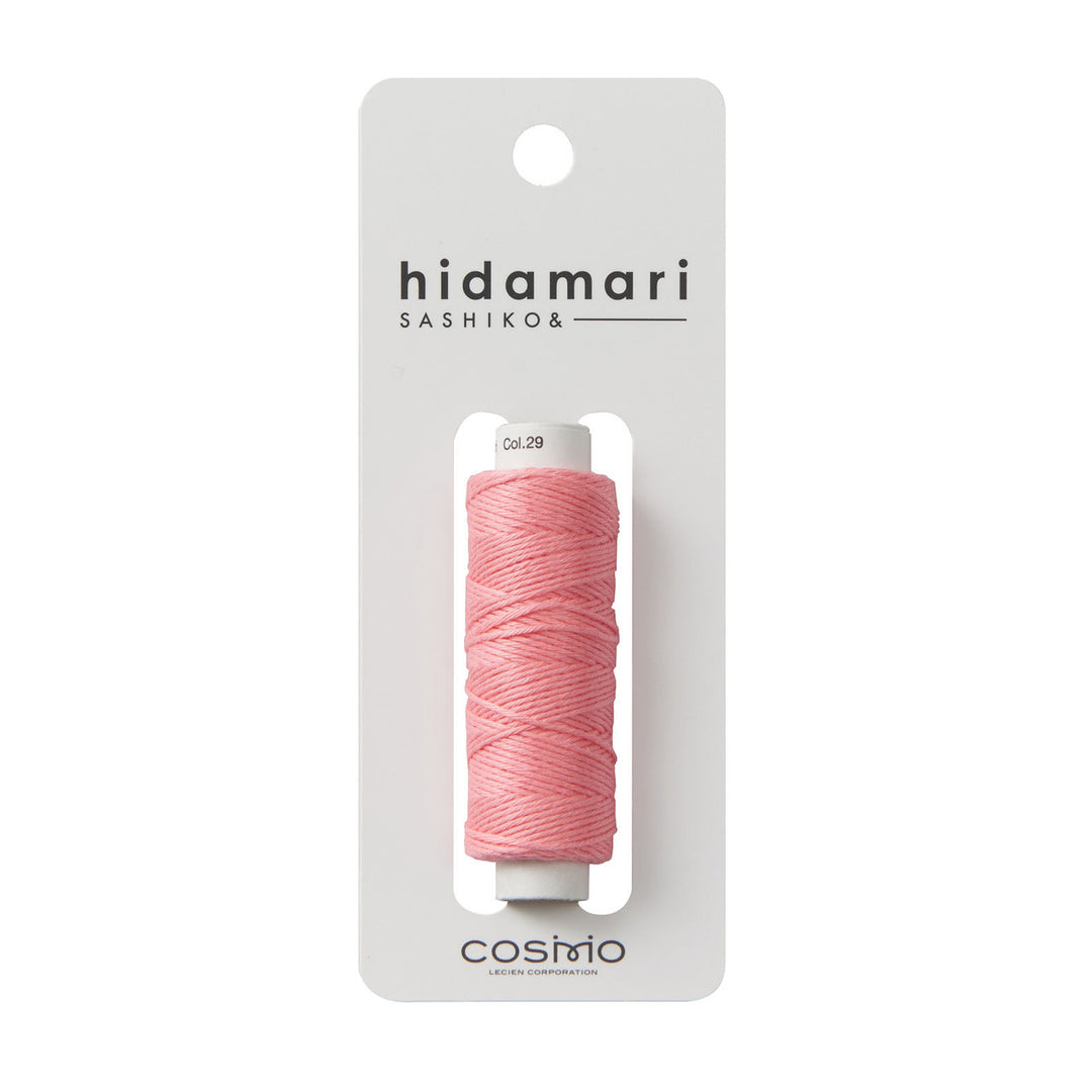 Cosmo Hidamari Sashiko Thread - Salmon (#29) displayed on a white card, showcasing soft pink thread ideal for Sashiko embroidery and Japanese craft supplies.