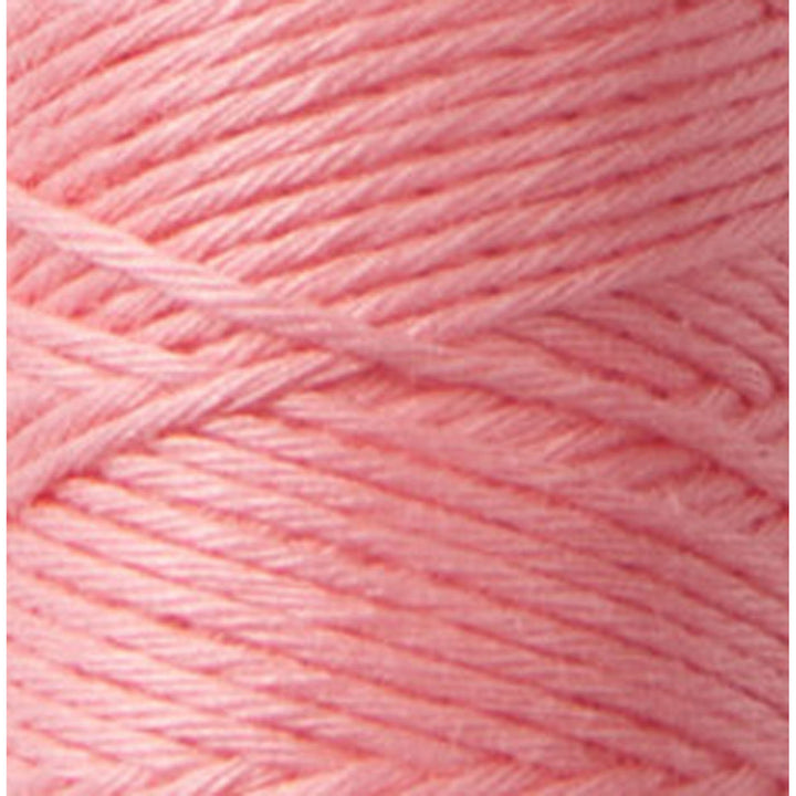 Close-up of soft salmon-colored thread showcasing fine texture and sheen of Cosmo Hidamari Sashiko Thread - Salmon (#29), ideal for Japanese craft supplies and sashiko embroidery projects.