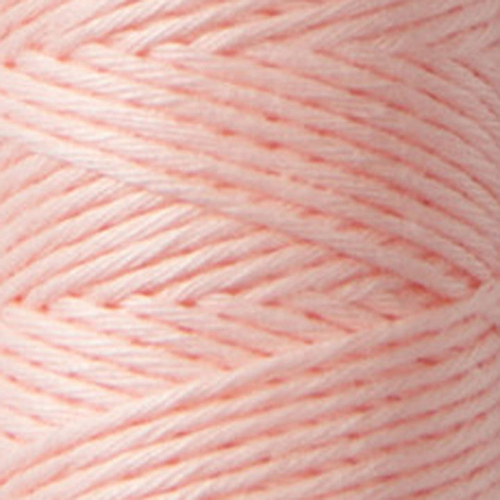 Close-up view of soft pink thread strands in Cosmo Hidamari Sashiko Thread - Soft Pink (#30), ideal for Japanese craft supplies and modern needlework projects.
