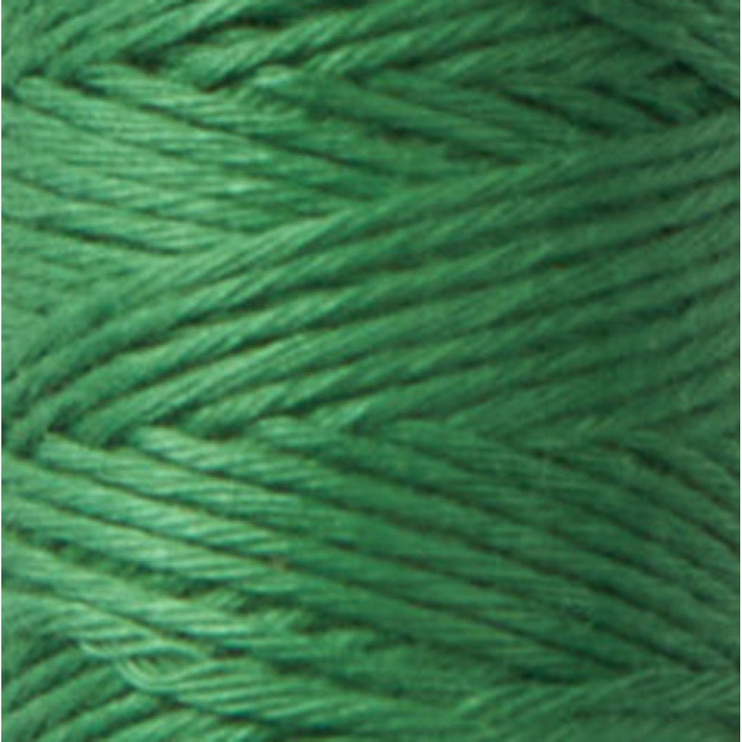 Close-up of green embroidery thread spool showcasing smooth texture of Cosmo Hidamari Sashiko Thread - Green (#31) for Sashiko and needlework projects.