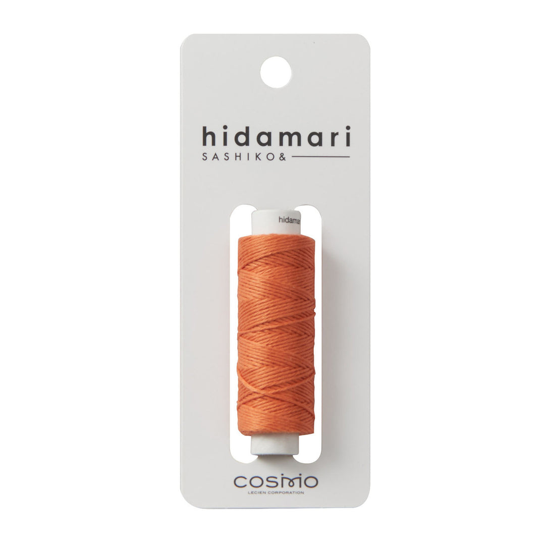 Cosmo Hidamari Sashiko Thread - Terracotta (#32) in a spool of high-quality Japanese embroidery thread, ideal for sashiko, needlepoint, and modern needlework projects.