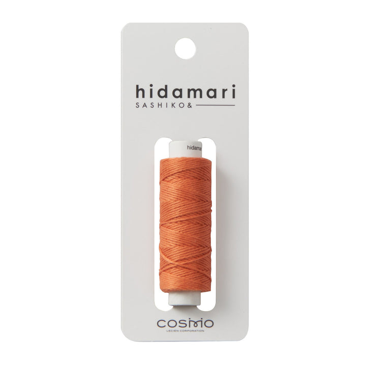Cosmo Hidamari Sashiko Thread - Terracotta (#32) in a spool of high-quality Japanese embroidery thread, ideal for sashiko, needlepoint, and modern needlework projects.