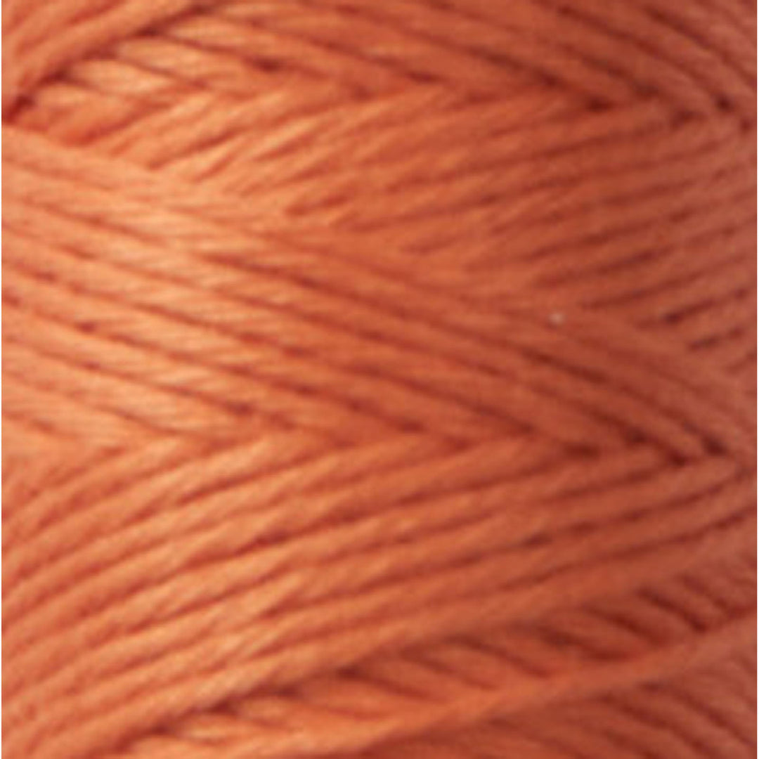 Close-up view of Cosmo Hidamari Sashiko Thread - Terracotta (#32) showcasing the vibrant orange color and smooth texture of this Japanese craft embroidery thread.