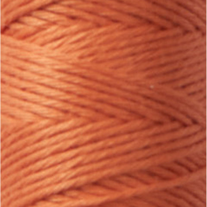 Close-up view of Cosmo Hidamari Sashiko Thread - Terracotta (#32) showcasing the vibrant orange color and smooth texture of this Japanese craft embroidery thread.