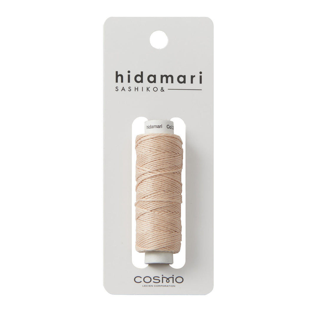 Cosmo Hidamari Sashiko Thread - Peach Fuzz (#33) in soft peach shade, high-quality Japanese craft supply ideal for Sashiko and embroidery projects.