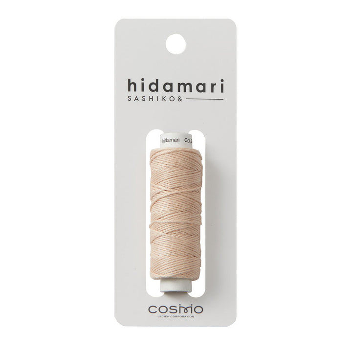 Cosmo Hidamari Sashiko Thread - Peach Fuzz (#33) in soft peach shade, high-quality Japanese craft supply ideal for Sashiko and embroidery projects.