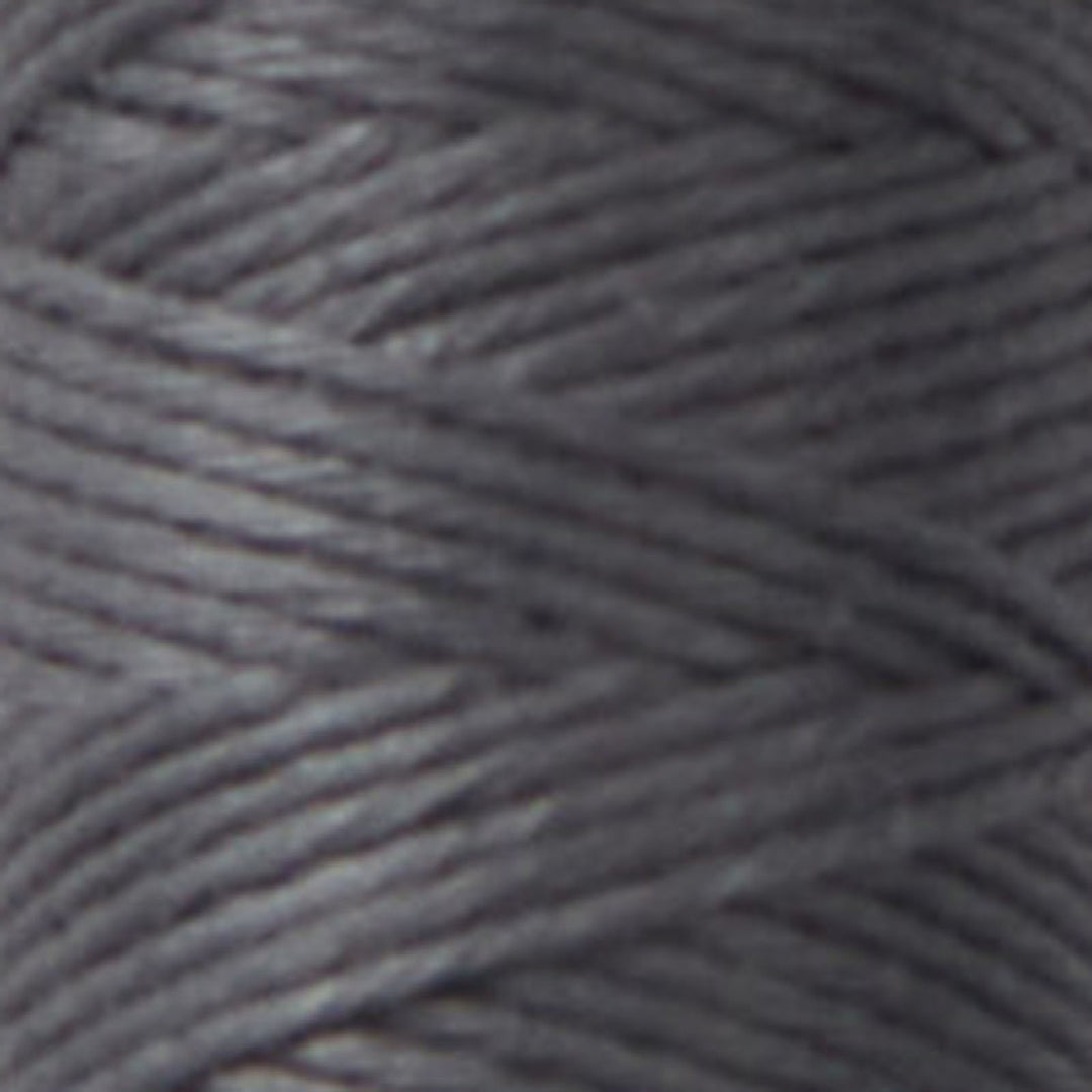 Close-up view of dark gray thread spool featuring Cosmo Hidamari Sashiko Thread - Iron (#35), ideal for Sashiko embroidery and Japanese craft supplies.