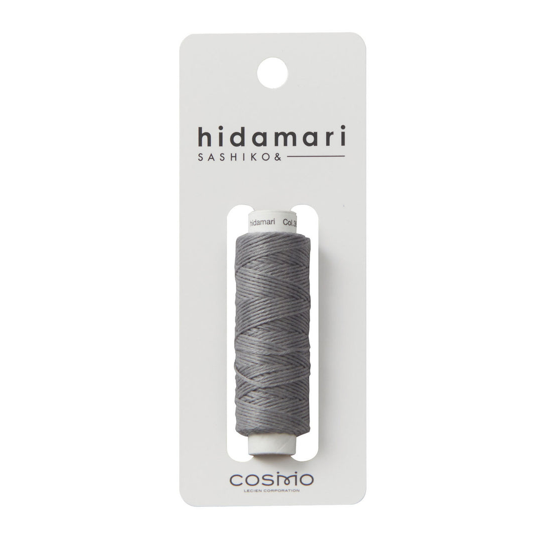 Cosmo Hidamari Sashiko Thread - Pewter (#36) spool of gray embroidery thread designed for sashiko and Japanese craft supplies, ideal for needlework and modern stitching projects.