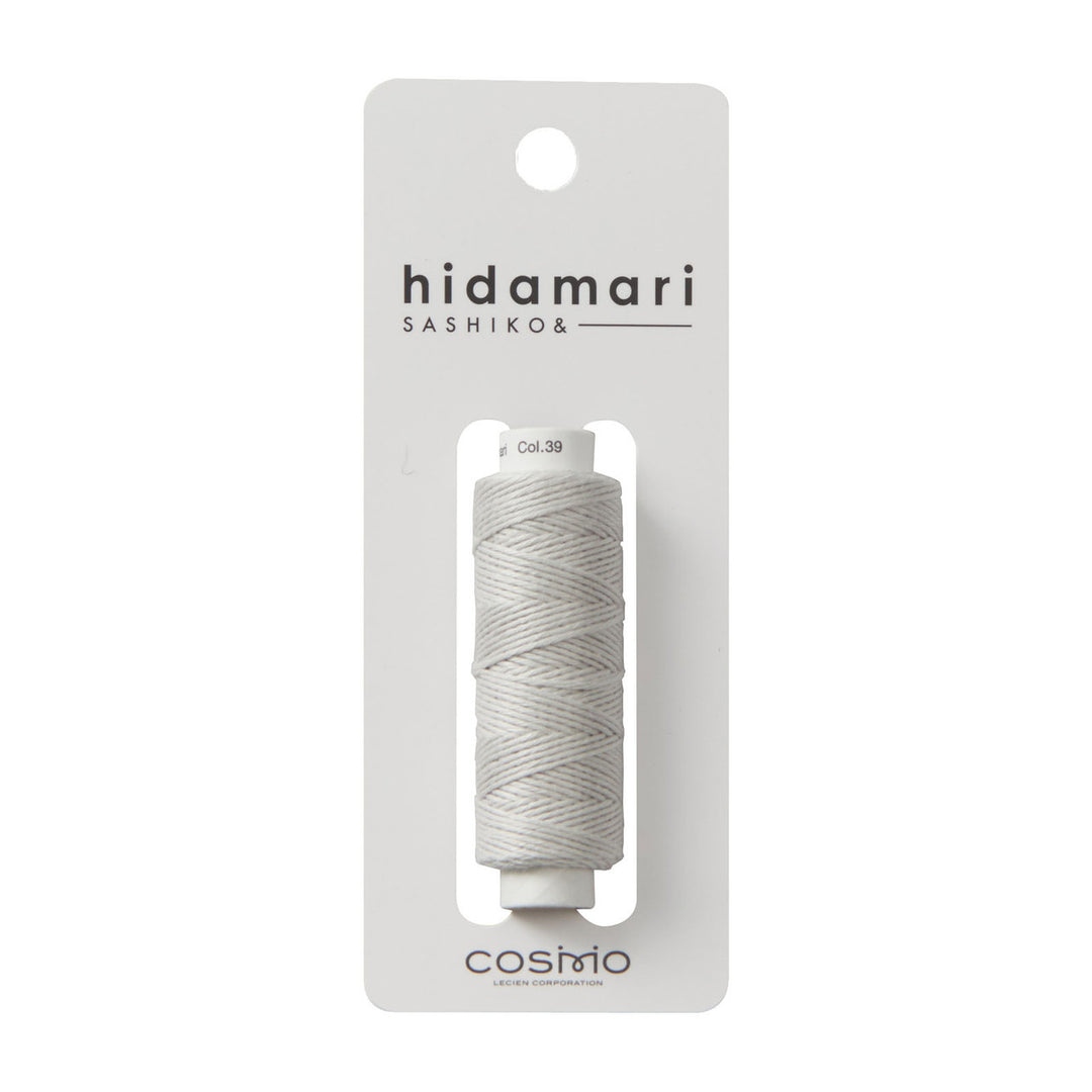 Cosmo Hidamari Sashiko Thread - Misty Coast (#39) in a soft gray tone, ideal for Japanese craft supplies and modern needlework projects including sashiko embroidery.