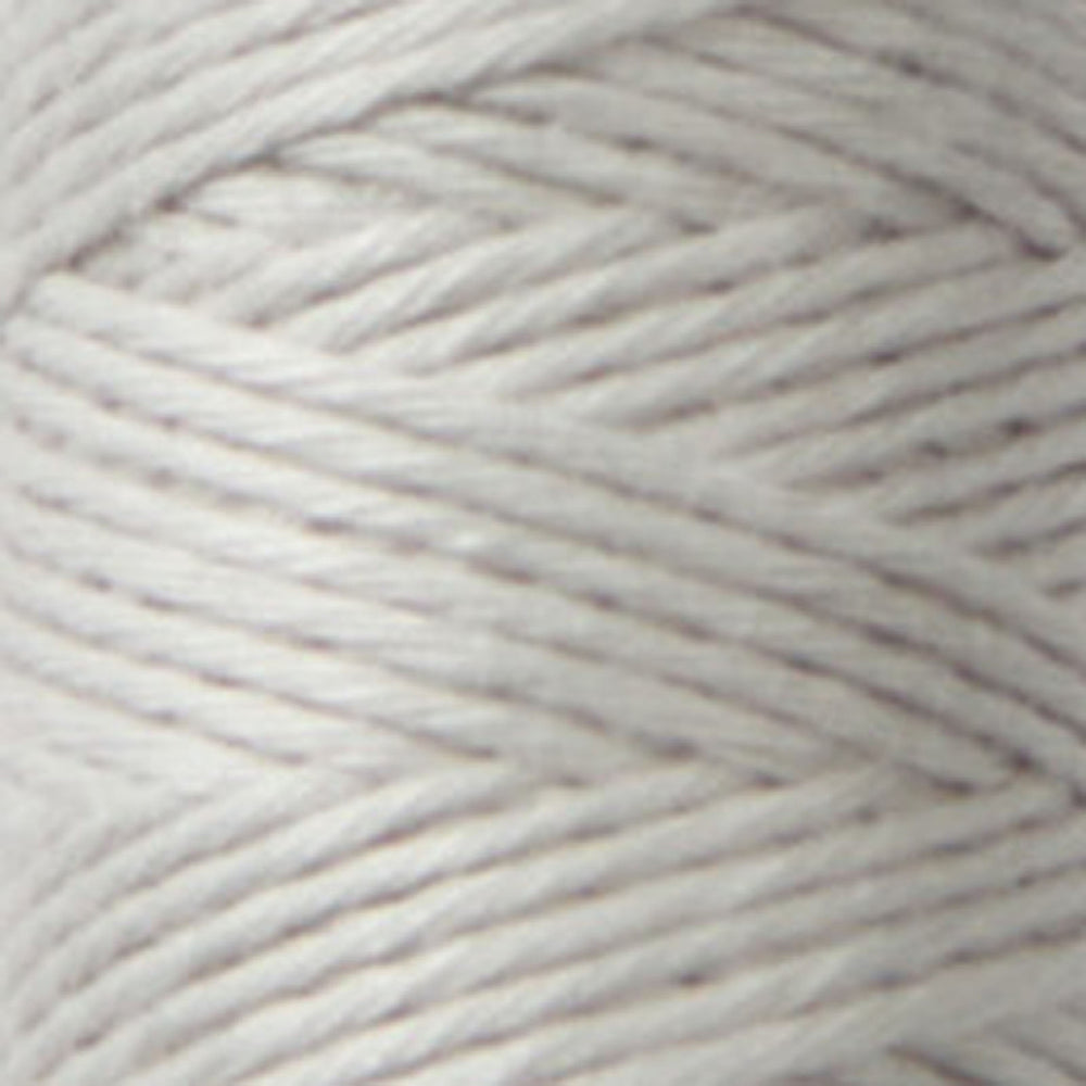 Close-up of soft, light gray Cosmo Hidamari Sashiko Thread - Misty Coast (#39) spool showcasing fine texture ideal for Japanese craft supplies and modern needlework projects.