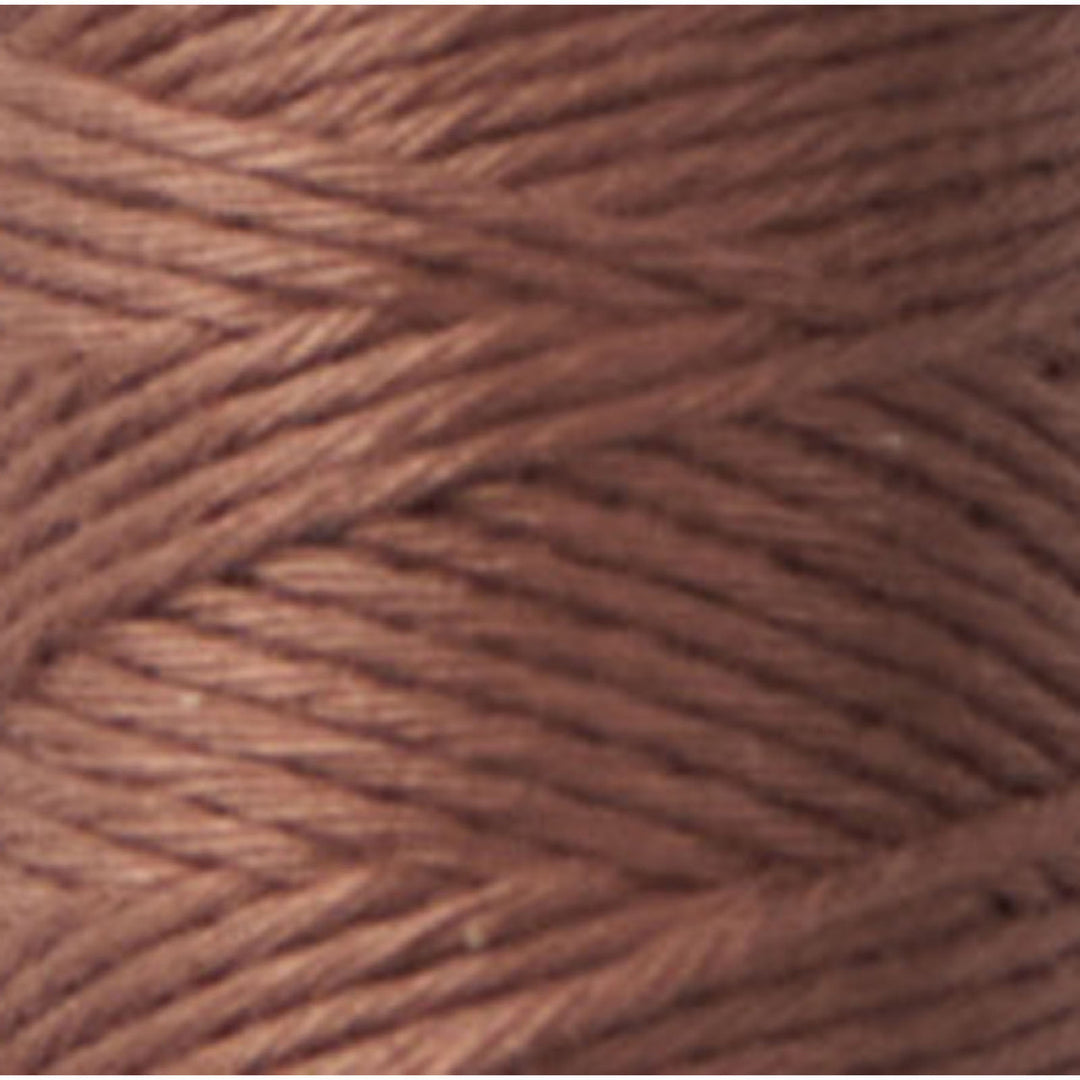 Close-up of soft, tightly wound brown thread spool, showcasing texture and color of Cosmo Hidamari Sashiko Thread - Brown (#40) for Japanese craft supplies and embroidery projects.