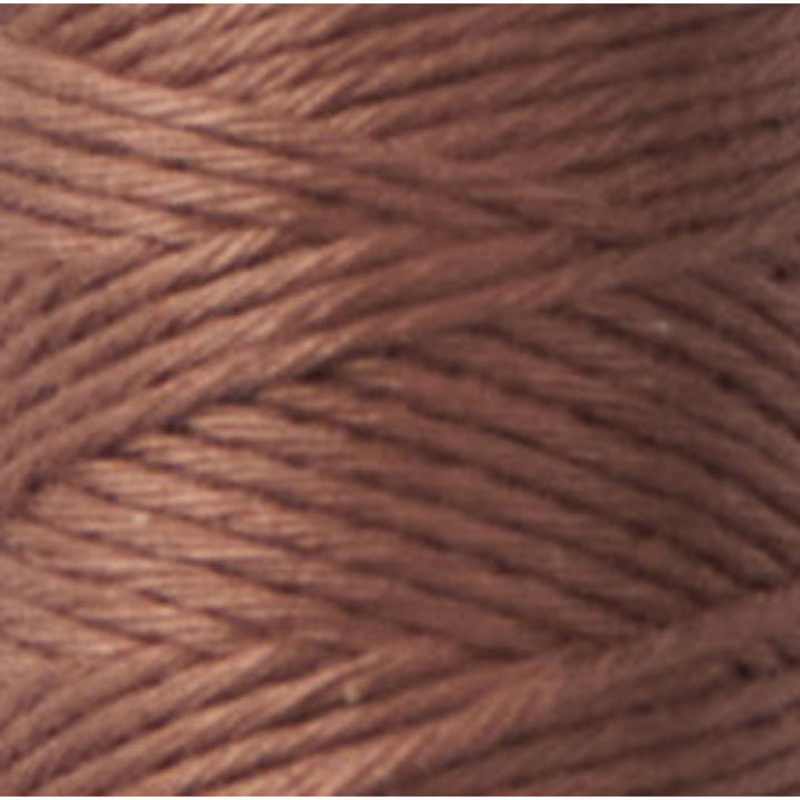 Close-up of soft, tightly wound brown thread spool, showcasing texture and color of Cosmo Hidamari Sashiko Thread - Brown (#40) for Japanese craft supplies and embroidery projects.