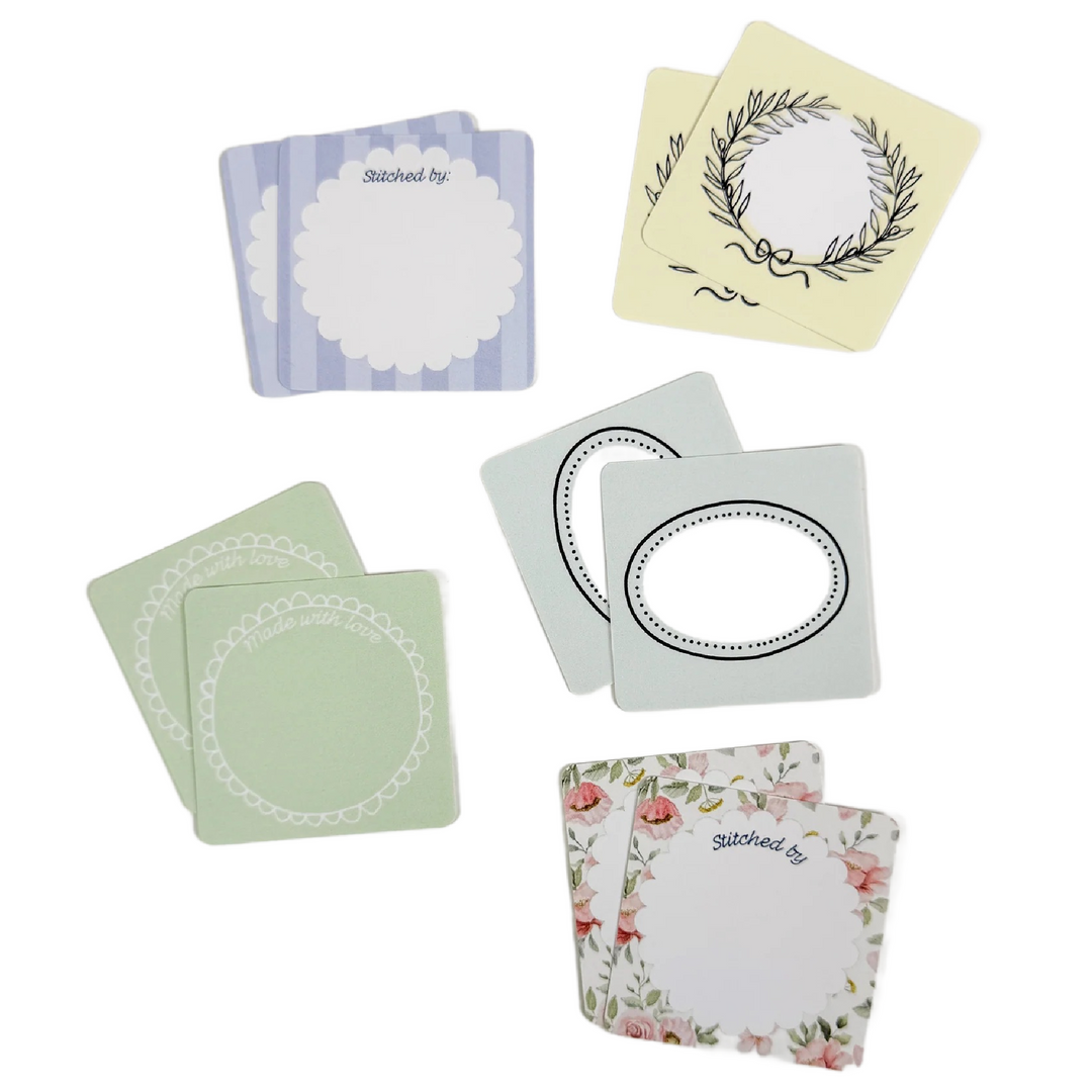 Made By" Project Label Sticker Pack featuring assorted decorative labels with floral, wreath, and simple border designs, perfect for embroidery, cross stitch, and modern needlework projects.