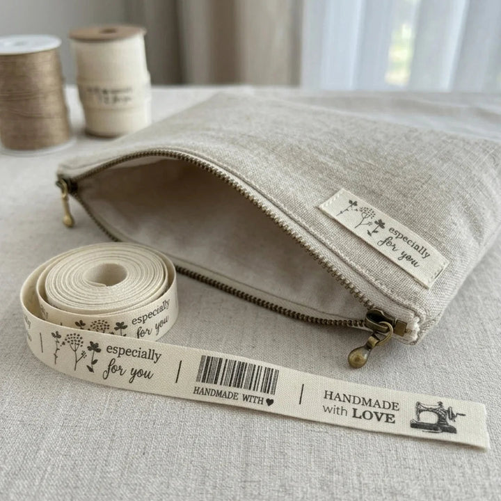 Fabric pouch with zipper and measuring tape on a neutral background