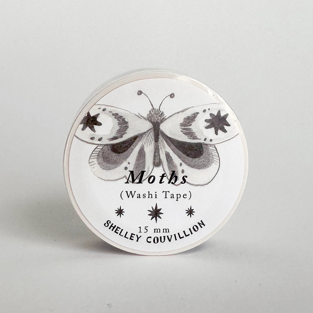 Washi tape with butterfly design and 'Shelley Couvillion' branding on a gray background