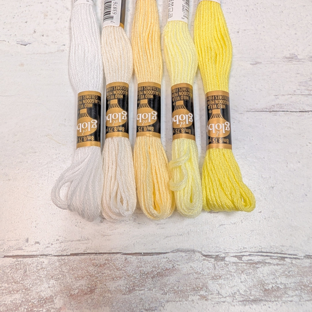 Hilo Vela El Globo Embroidery Thread (8m Skeins) - Light Yellows in a range of soft to bright yellow shades, ideal for embroidery, cross stitch, and Japanese craft supplies.