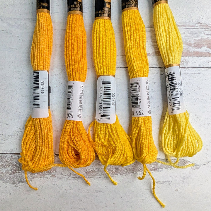 Hilo Vela El Globo Embroidery Thread (8m Skeins) -Yellows arranged in a row showing varying shades of yellow for embroidery, cross stitch, and modern needlework projects.