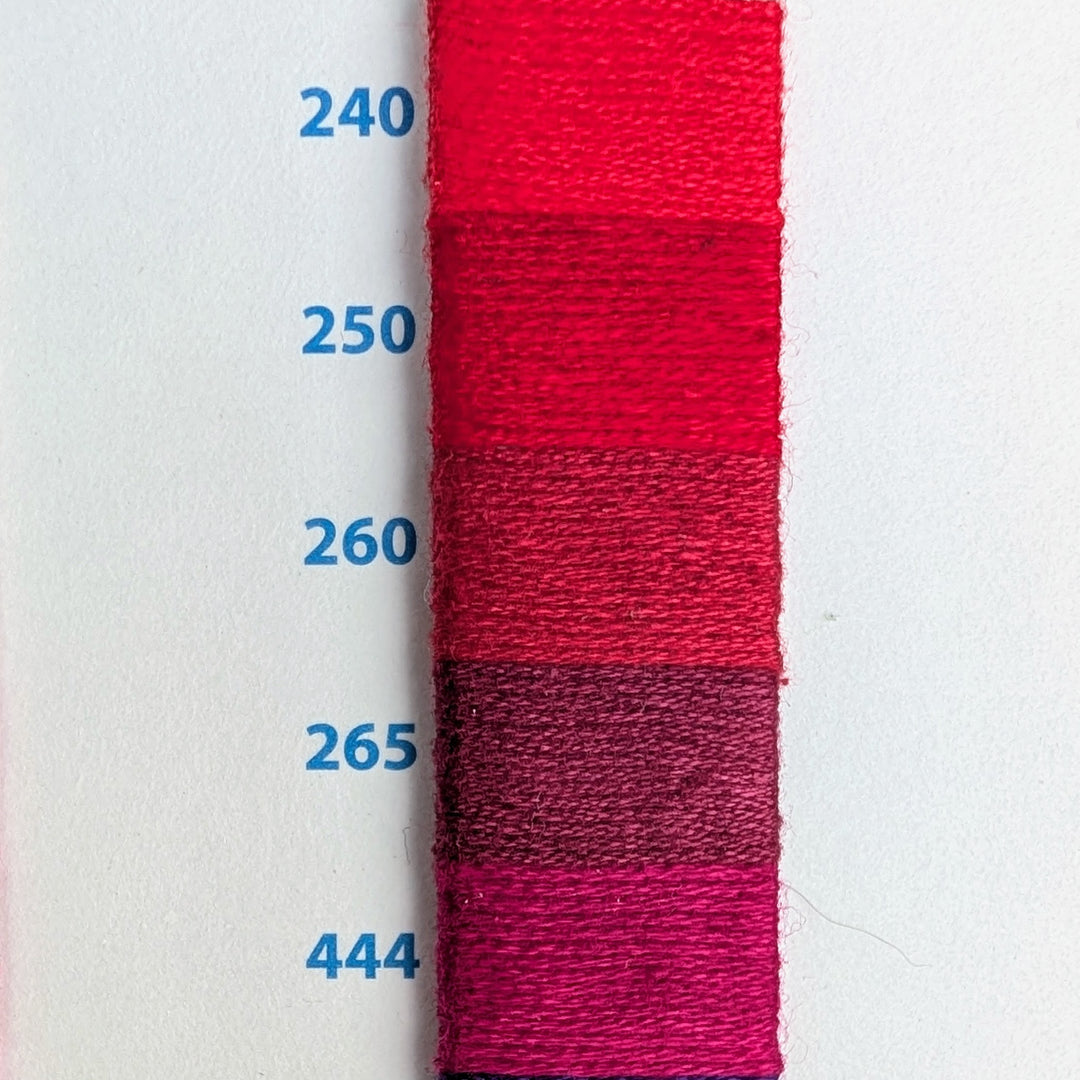 Hilo Vela El Globo Embroidery Thread (8m Skeins) - Reds showing five shades of red and pink embroidery floss samples numbered 240, 250, 260, 265, and 444 on white background for needlework projects.