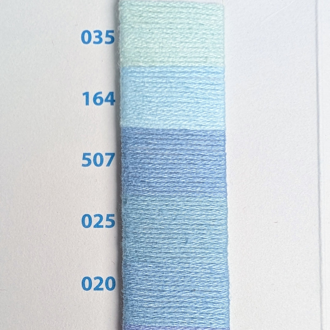 Hilo Vela El Globo Embroidery Thread (8m Skeins) - Light Blue shown in a gradient of light blue shades, ideal for modern needlework and Japanese craft supplies including sashiko and cross stitch projects.