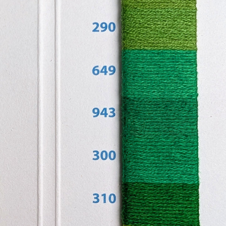 Hilo Vela El Globo Embroidery Thread (8m Skeins) - Green displayed in five shades of green on a white card with numbered color codes, ideal for hand embroidery and modern needlework.