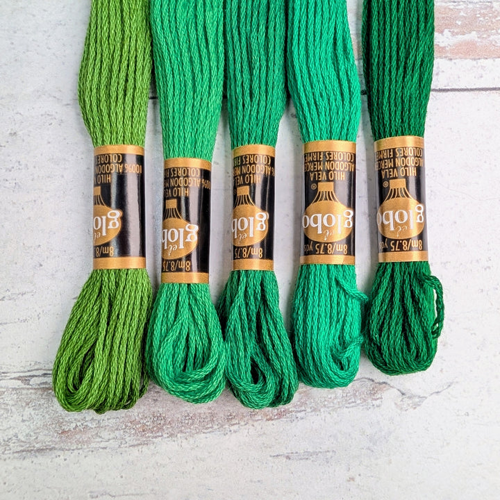 Hilo Vela El Globo Embroidery Thread (8m Skeins) - Green in various shades of green arranged side by side, ideal for hand embroidery, cross stitch, and modern needlework projects.