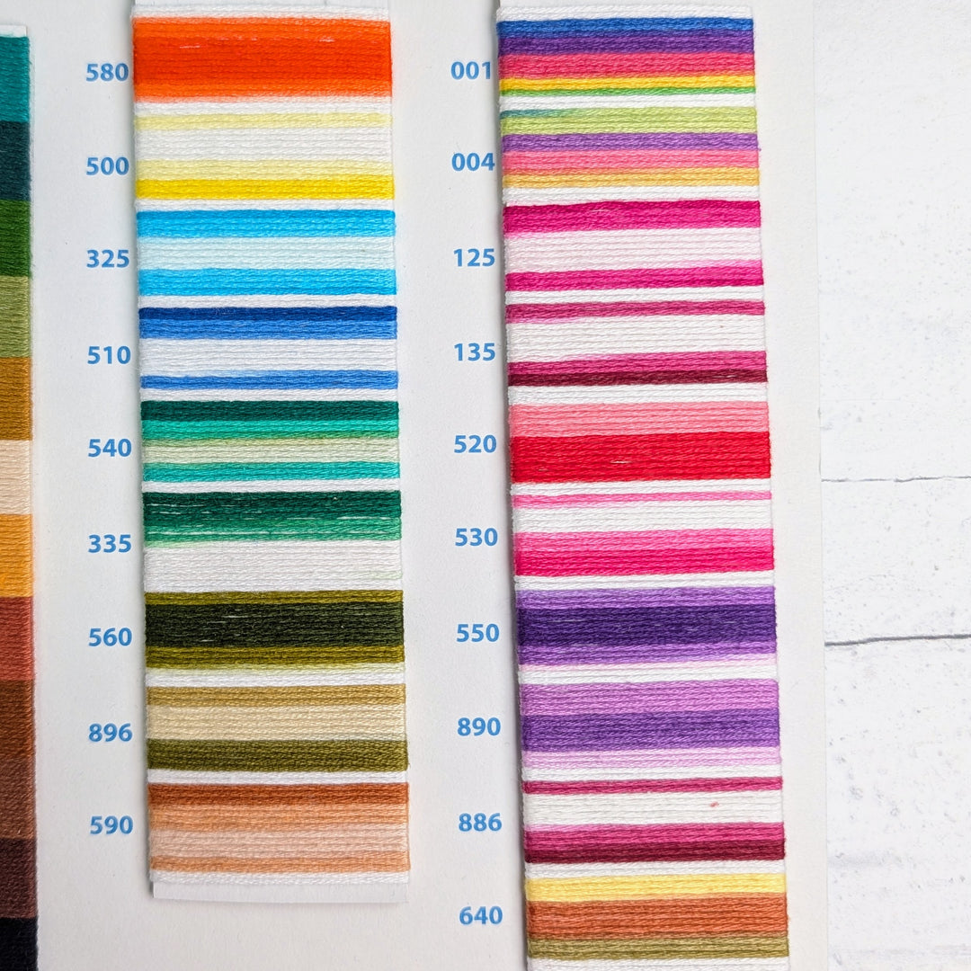 Hilo Vela El Globo Embroidery Thread (8m Skeins) - Variegated Two showing a vibrant array of colorful needlepoint threads organized by number, ideal for modern embroidery and Japanese craft supplies.