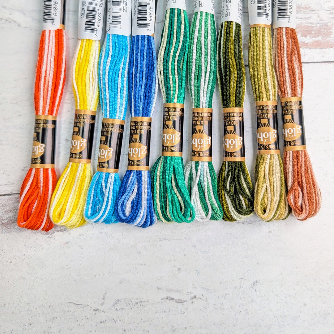 Hilo Vela El Globo Embroidery Thread (8m Skeins) - Variegated One skeins in vibrant striped colors including orange, yellow, blues, greens, olive, and brown, ideal for Japanese craft and modern needlework.