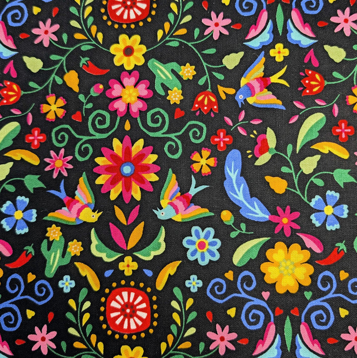 Close-up of Japanese Cotton Fabric - Otomi Fiesta Floral on Black (NN1911F) featuring a vibrant, colorful floral and bird pattern on a black background, ideal for modern needlework and Japanese craft supplies.