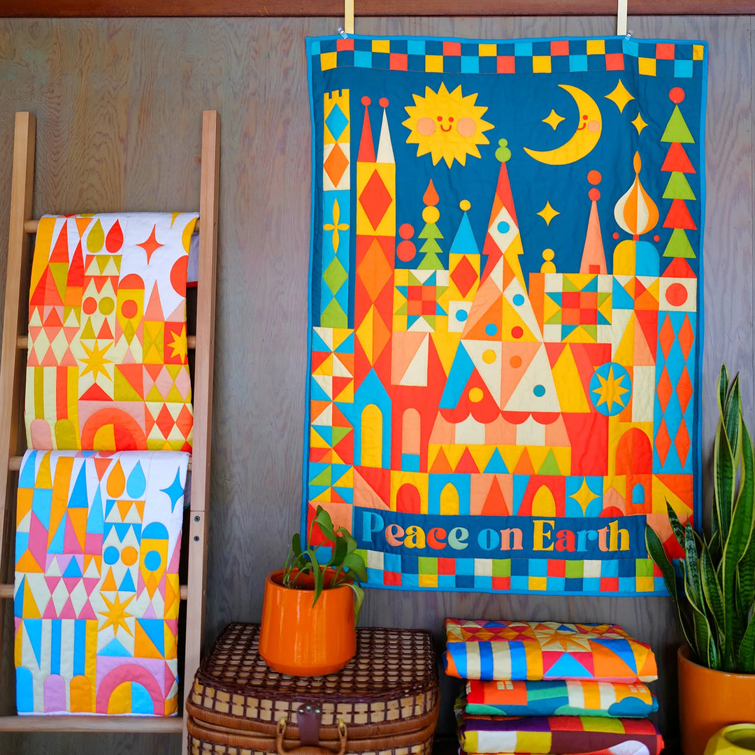 Peace on Earth Whole Cloth Quilt Kit featuring vibrant geometric shapes and colorful sun and moon motifs, ideal for modern needlework and embroidery craft enthusiasts.